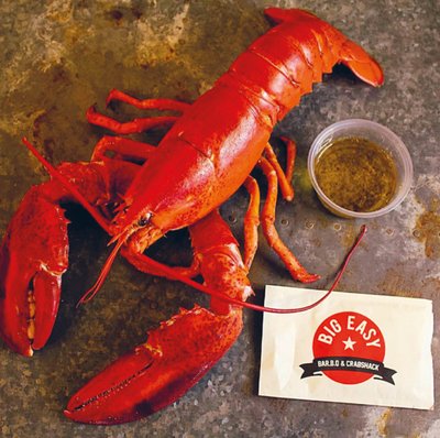 Red lobster with a sauce pot and napkin