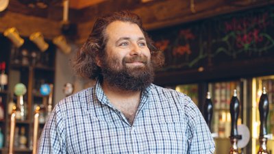 Bearded man pale blue checkered shirt