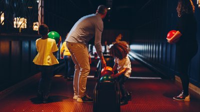 Small child bowling