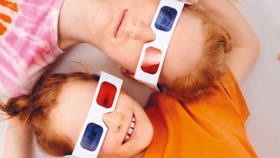 Boy girl laying down blue red 3D glasses