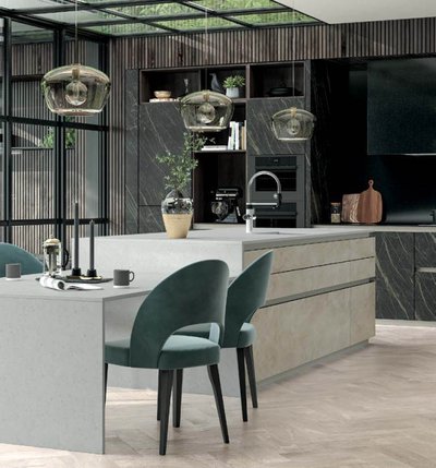 Grey and green kitchen with green velvet barstools and domed lampshades
