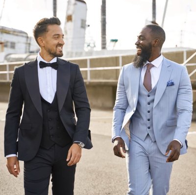 Man black suit bowtie pale blue suit
