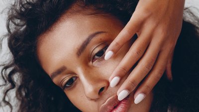 Woman with white painted nails