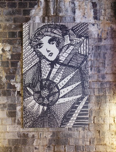 Art hung on brick wall