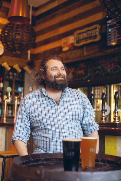 Bearded man pale blue checkered shirt